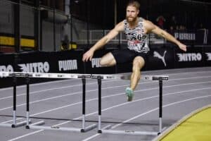 This picture shows Life U student and graduate assistant C.J. Allen hurdling over a hurdle during his U.S. record run.
